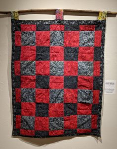 Leanora E. Mims • <em>Say Her Name: We Will Remember Miriam Carey</em> • Cross square quilting pattern • 26½“×43“ • $800.00<a class="purchase" href="https://state-of-the-art-gallery.square.site/product/leanora-e-mims-say-her-name-we-will-remember-you/384" target="_blank">Buy</a>